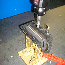 Measuring machine measures a plastic part